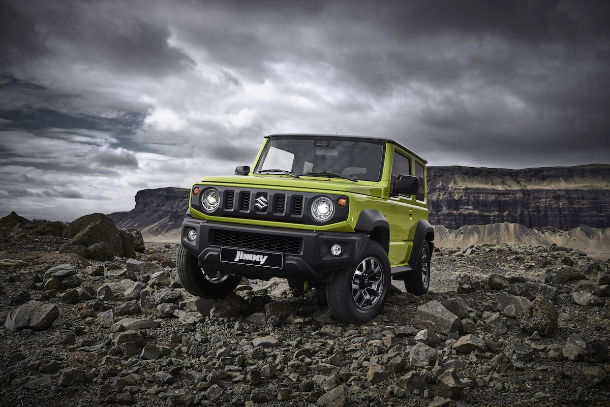 Front view of a Suzuki Jimny offroad in the mud